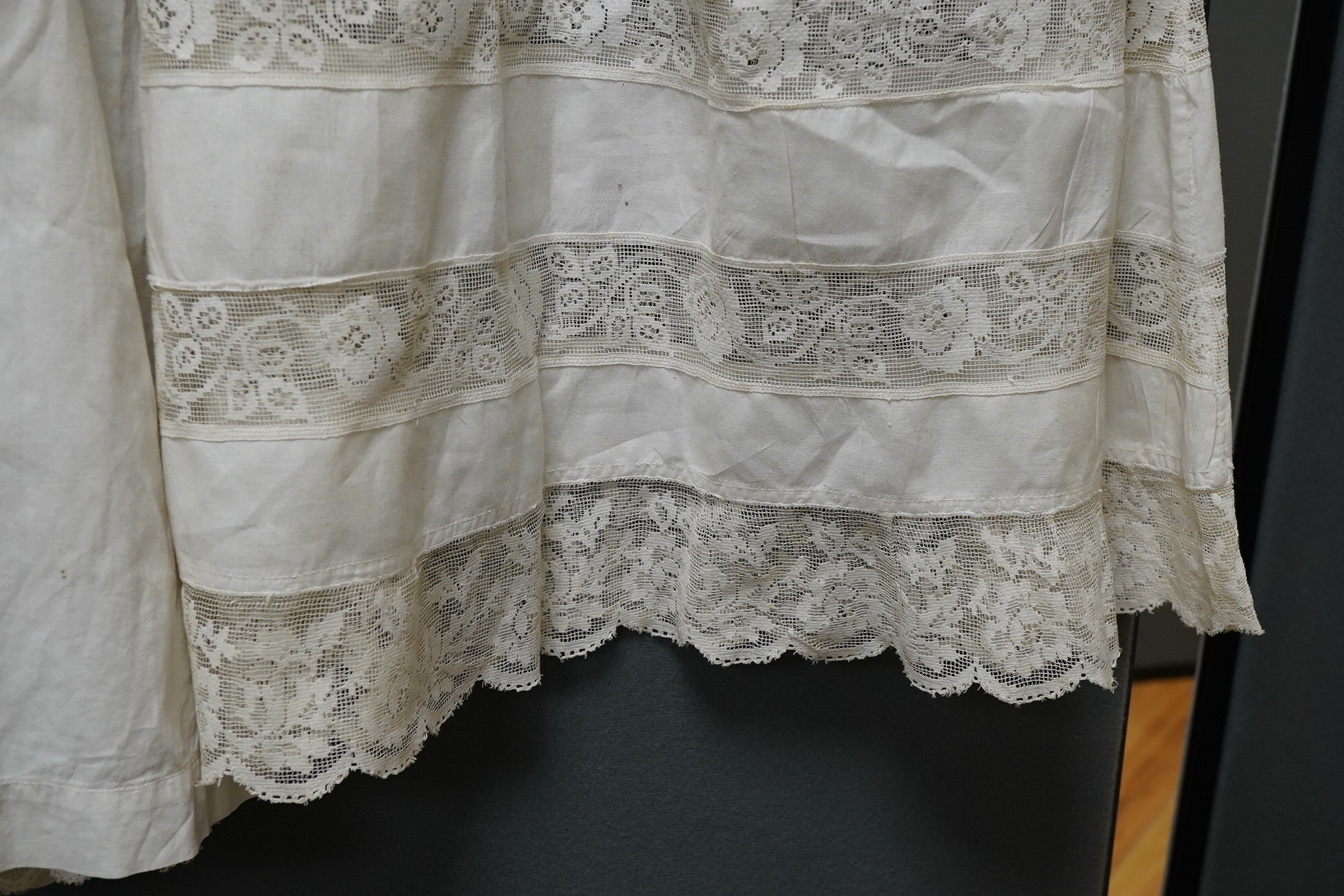Three 20th century baby’s cotton and machine lace night-dresses